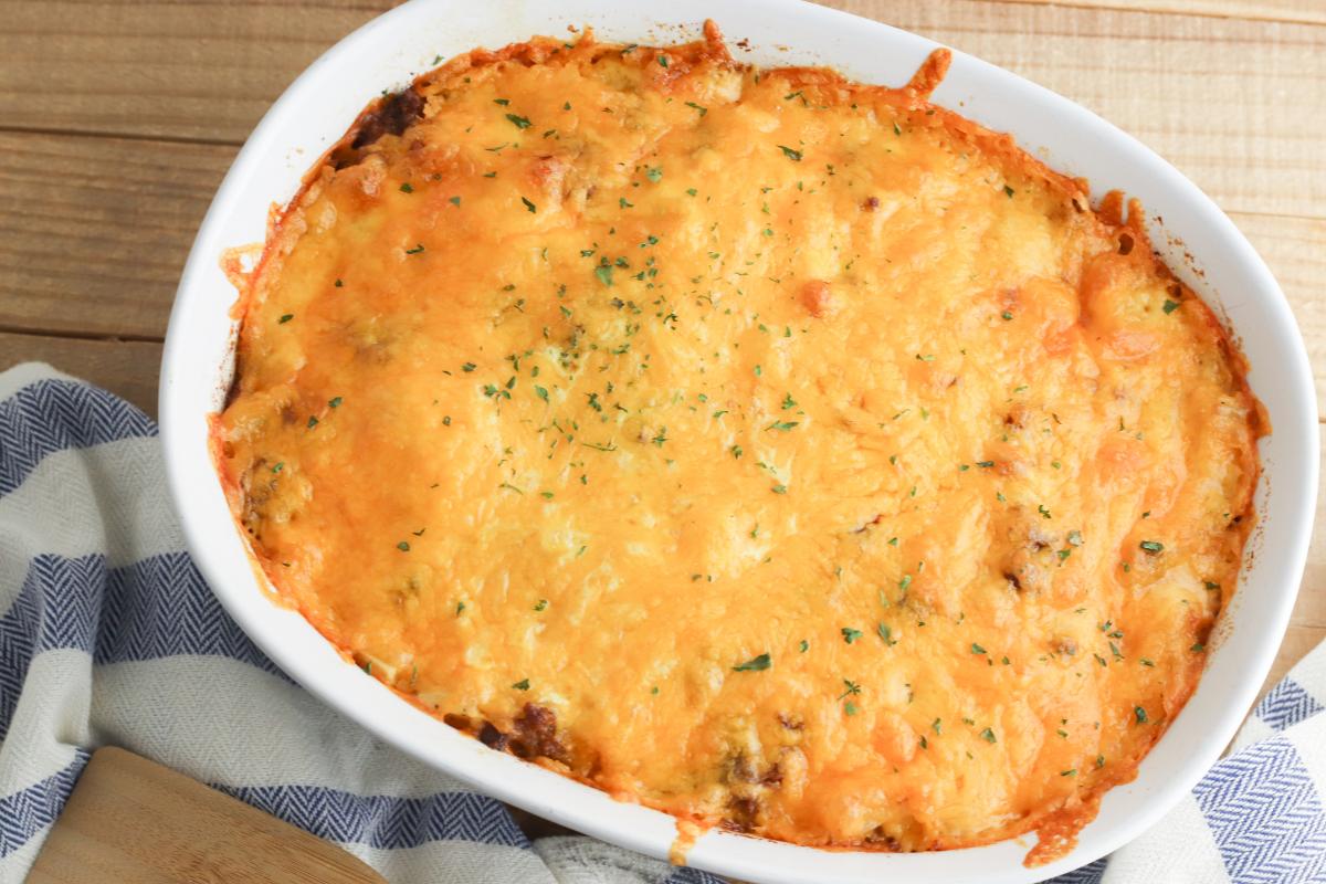 cooked breakfast casserole with melted cheese on the top cooling before being served for breakfast for dinner.