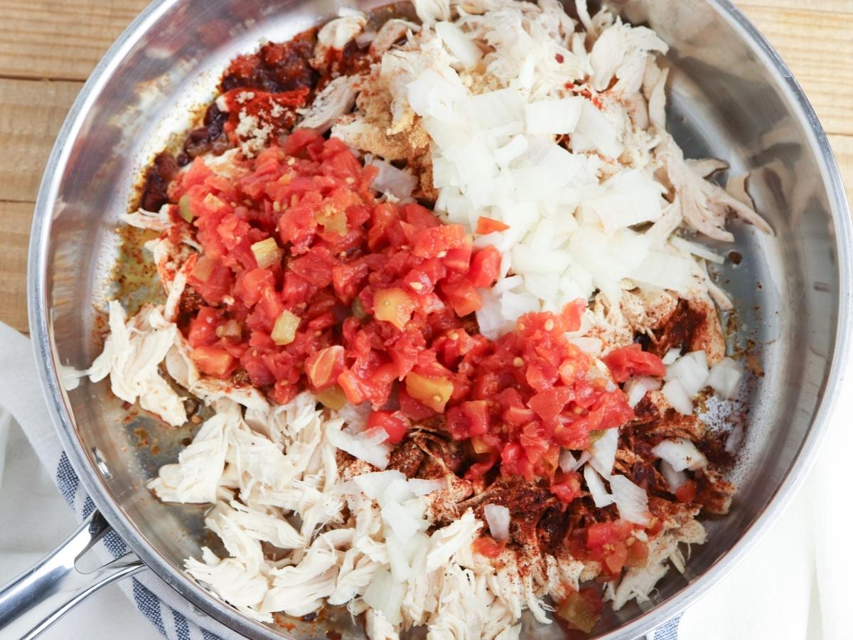 ingredients for turkey tacos in a stainless steel skillet